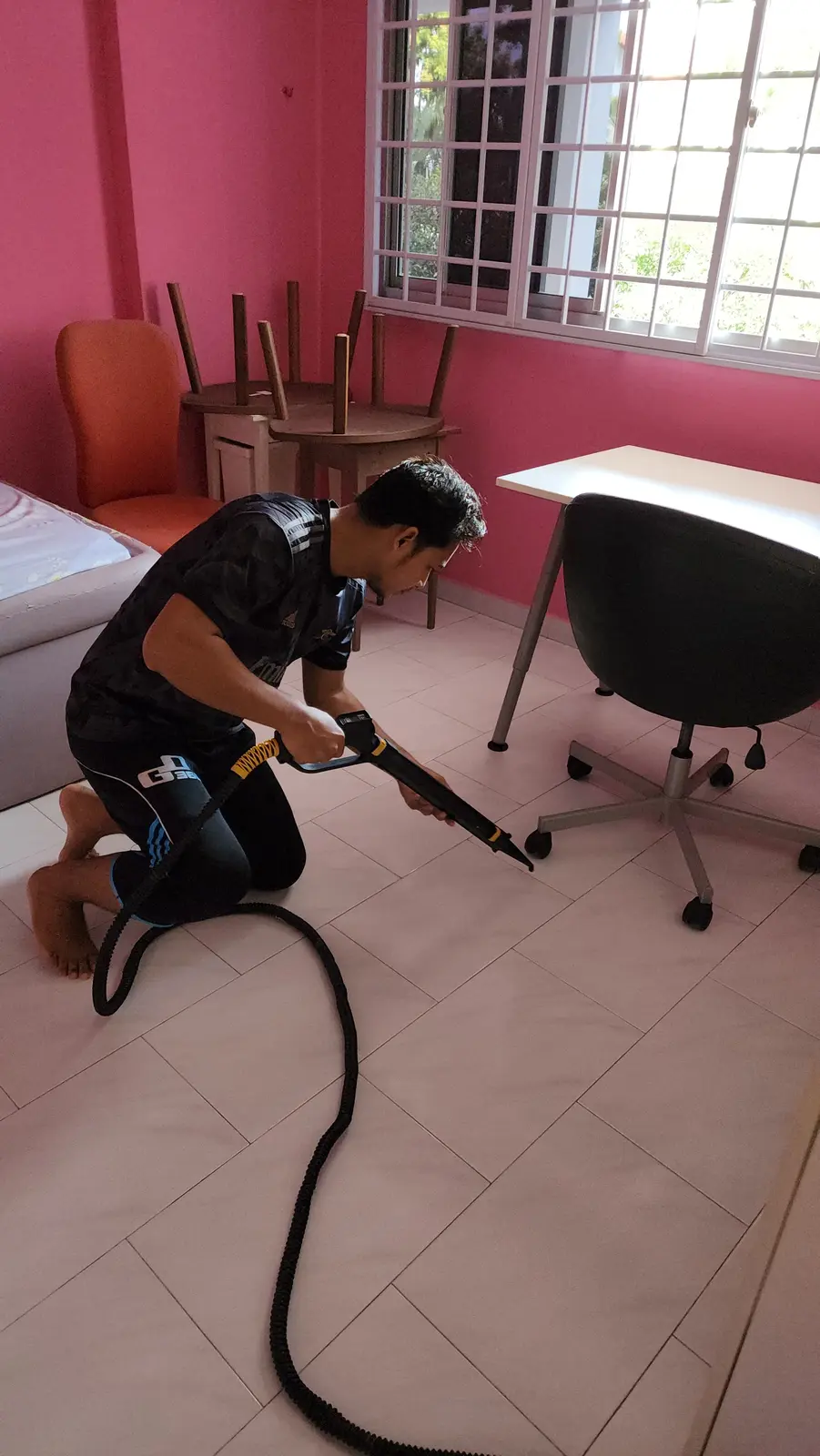 MyCleanHome part-time cleaner vacuuming a bedroom