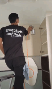 Technician performing formaldehyde removal using nano mist spray in a newly renovated room.